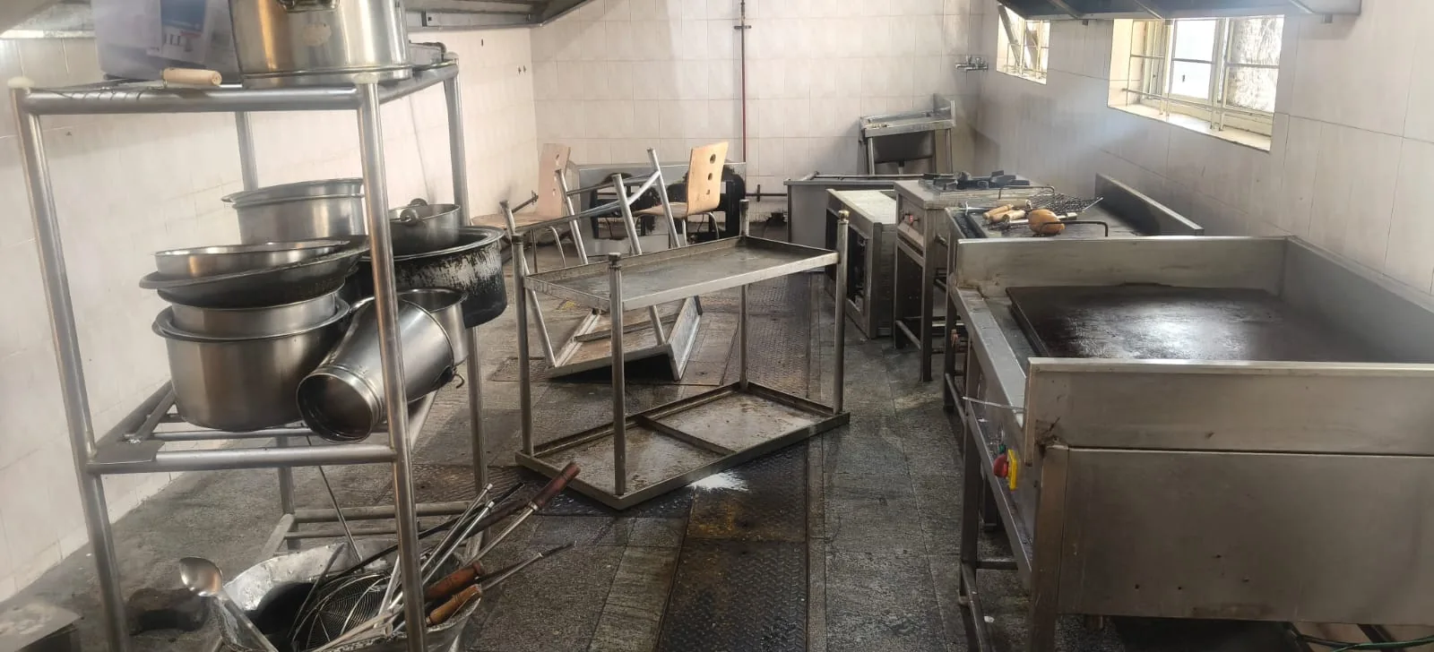 Professional pest control inspection in the common area of a residential complex in Bangalore